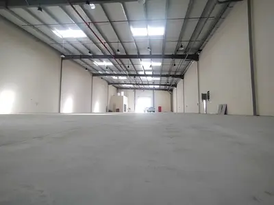 Warehouse for rent in Al Sajaa, 8,500 sq ft, with office, kitchen, and bathroom, 50 kW power. Exclusive limited offer.