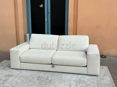 Pull out Italian Natuzzi Two seater sofa bed with mattress