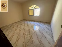 Two rooms and a ground floor hall for rent in Al Mowaihat 3 - strategic location and special price.