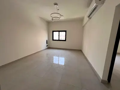 Two rooms and a hall in Al Majaz 2, first occupant, balcony, distinctive finishes, one month deferred deposit, and payment in 4-6 installments.