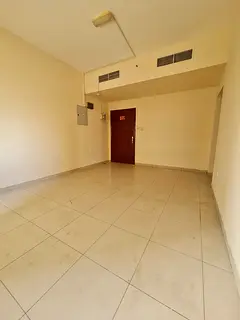Two-bedroom apartment with living room in Al Naba’a, central AC and gas. Annual rent 33,000 AED in