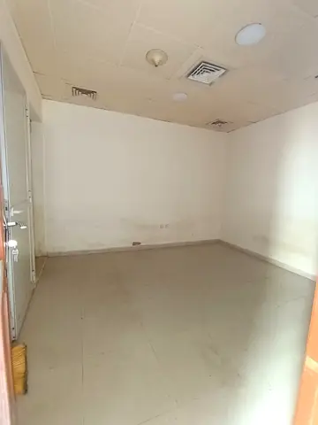 Studio for rent in Al Khan Sharjah, 1 room, kitchen, bath, central AC, parking, ideal for families & bachelors, price 18000 AED, 5 payments, deposit 2