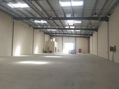 8,500 sq.ft warehouse, 50 kW electricity, AED 480,000, with office, kitchen, and bathroom.
