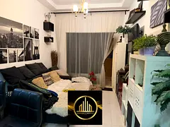 For sale: a room, a living room, two bathrooms, and a parking space inside the building