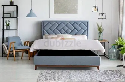 Stylish Blue Upholstered Bed with Storage