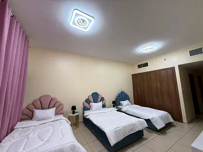 Two-bedroom apartment with a living room in Ajman, Al Rashidiya area.