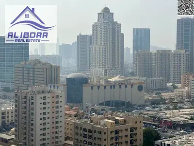 🏤 شقة غرفتين وصالة للبيع – النعيمية تاور C   🌄 إطلالة مفتوحة على مدرسة الحكمة وفندق بلاك رامادا