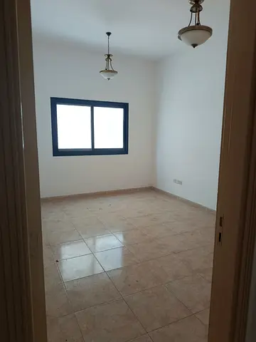 Two bedroom hall apartment for rent in Al Majaz 3 main road 48000 yearly 4 cheques 2000 cash deposit AC by landlord