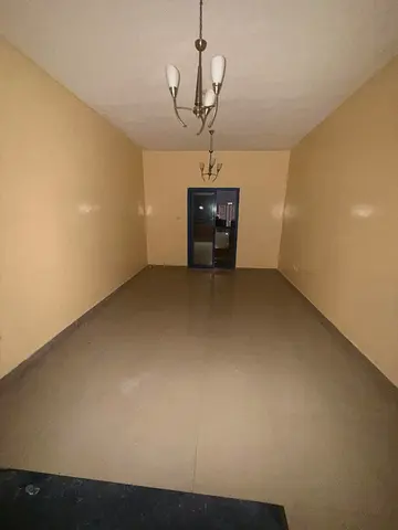 💯 Annual Rent in Ajman 💦 Spacious Studio Apartment with American-Style Kitchen, Balcony, and Central Air Conditioning 🏡 Location: Al Nuaimiya 1 ✅ P