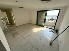 Two bedroom apartment with balcony and two bathrooms in Al Butina Sharjah spacious and family-friend