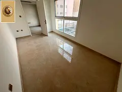 Upscale two-bedroom apartment with a living room, gym, and swimming pool, near Dubai exit.