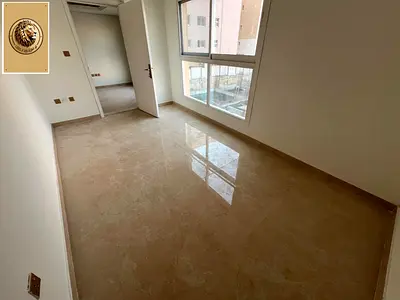 Upscale two-bedroom apartment with a living room, gym, and swimming pool, near Dubai exit.