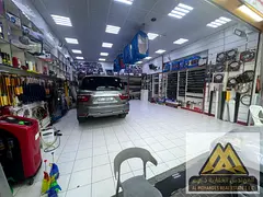A large car accessories shop with an attached storage room.