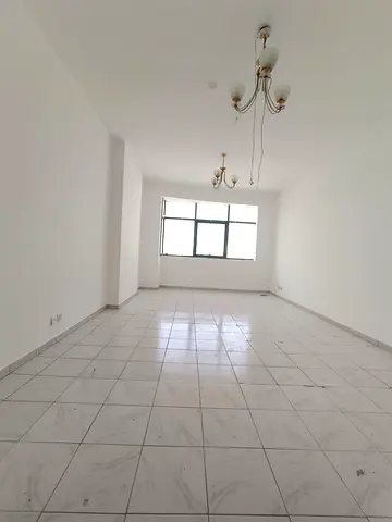 For rent in Al Jubail: spacious 2BR + hall, 2 master baths, large kitchen, central AC, near Al Jubail bus station and services.