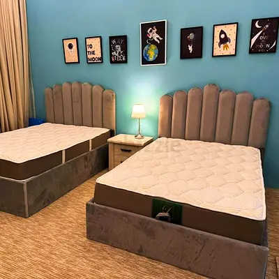 Elegant Grey Beds with Soft Headboards
