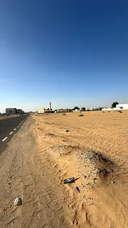 Two adjacent plots of land for sale in Muzairah