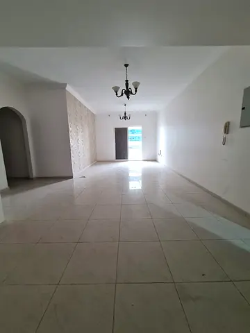Two bedrooms and a living room in Al Qasba with a balcony, free parking, 2 bathrooms, large spaces, flexible payment facilities, 59,000 AED.