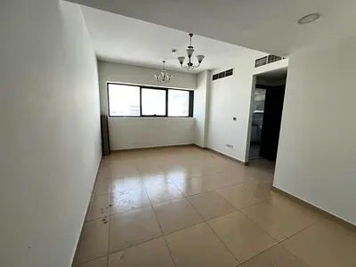 غرفة وصالة بالتعاون، برج جديد وثاني ساكن بحالة أول ساكن، قريب جدًا من مخرج دبي وصيانة مجانية بالكامل.