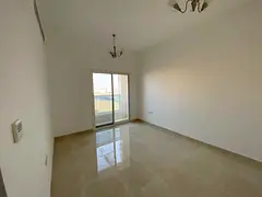 One bedroom, living room, two bathrooms, and balcony in Al-Jarf 3. First occupancy, large area.