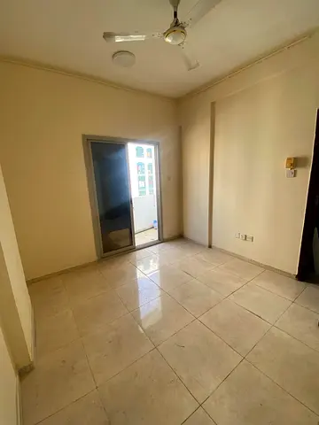 One-bedroom apartment with a living room, clear bachelor contract, in Umm Al Tarraqa near Al Butina, first occupancy after renovation, only 24,000 dir
