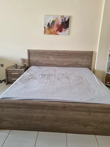 King size bed with mattress and side table