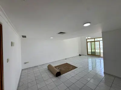 For rent: a spacious and elegant apartment in Ajman with 2 bedrooms, living room, 2 bathrooms, equipped kitchen, and balcony. The apartment offers wid