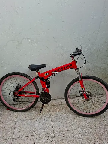 Red land rover cycle