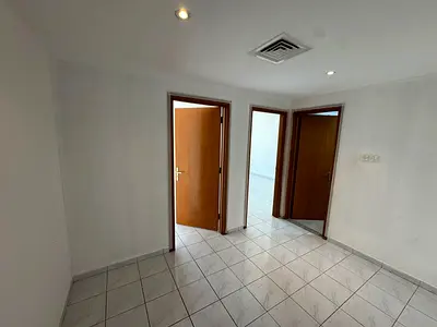 Beautiful 2-bedroom apartment for annual rent in Ajman. Large rooms, spacious hall, equipped kitchen, and balcony. Excellent location on a main street