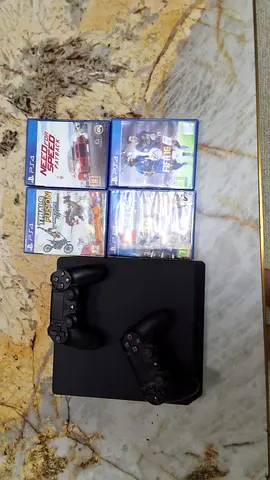 PlayStation 4 Console with Games and Controllers