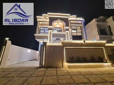 🏡 Independent Villa for Sale – 📍 Al Helio 1 – Ajman A luxurious classic-style villa with a stone façade, located in a prime location close to servic