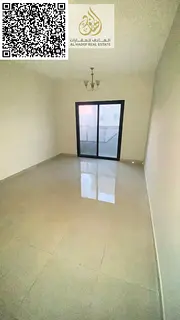 For rent in Ajman, a spacious one-bedroom apartment in Al Jurf 3 with a balcony. Flexible payment op