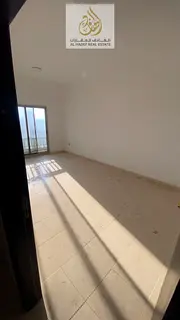A spacious 2-bedroom apartment with a living hall available for annual rent in Al Nuaimiya, located