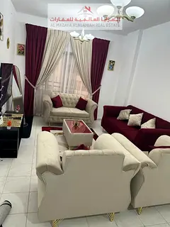sharjah Al Taawun, two rooms, a living room, a kitchen, two bathrooms, and a balcony. The price incl