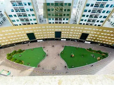 One-bedroom apartment for sale in Ajman Pearl Tower with parking and an open view of Ajman Creek.