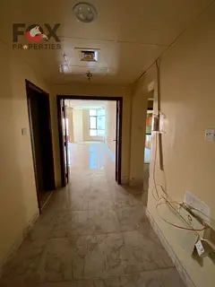 A 3-bedroom apartment for annual rent in Al Nuaimiya 1, featuring a balcony and a wonderful sky view