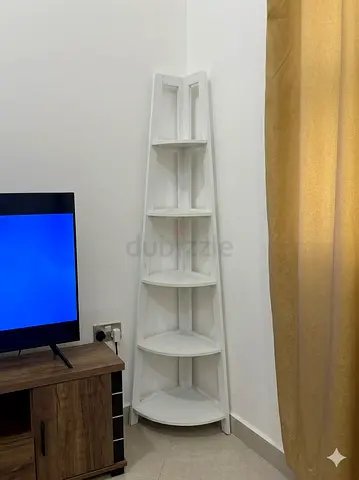Moving out soon and selling this white wooden corner stand.