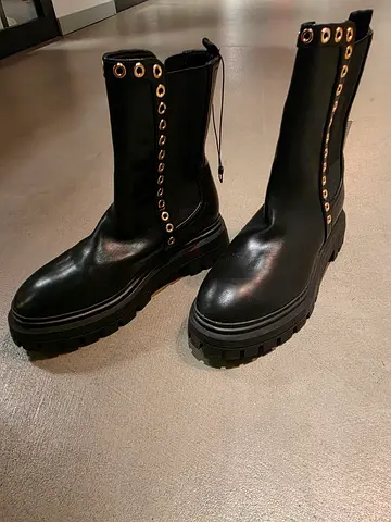 Trendy Black Ankle Boots with Decorative Eyelets