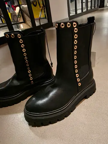 Trendy Black Ankle Boots with Decorative Eyelets