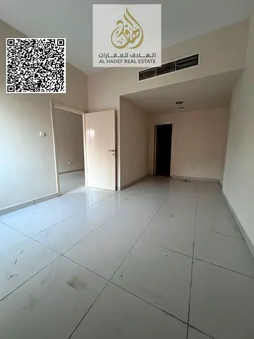 One bedroom and living room with two bathrooms and a built-in wardrobe, no balcony. Annual rent 29,000 AED, payable in four installments. Al Nuaimiya
