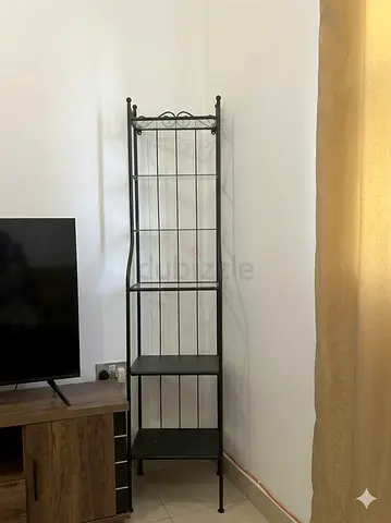 Metal stand with glass shelves. Very sturdy and looks great for decor or kitchen use.