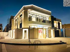 Villa for sale in Al Bahia, Ajman. 5 master bedrooms, a majlis (formal sitting room), a living room