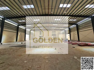 Brand-new industrial warehouse for sale with a 99-year leasehold, 200 kW power capacity, and a prime location directly on the main road in Umm Al Thao