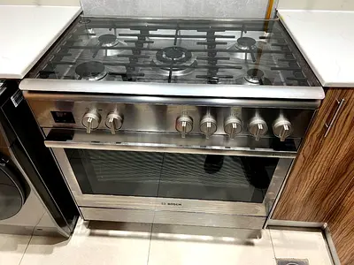 Bosch  5 burner gas with electric oven size 90-60cm