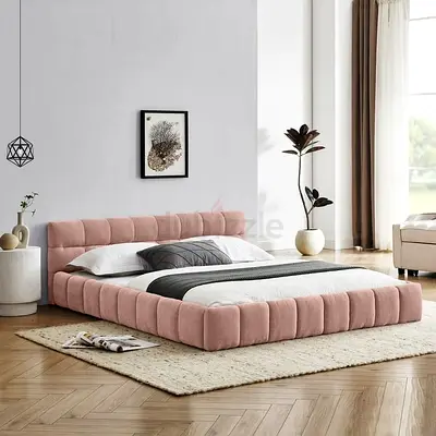 Pink velvet upholstered grounded super king bed
