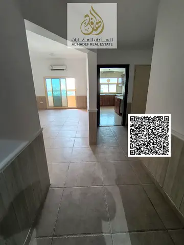 For rent in Ajman, a two-bedroom apartment with a living room in Al Rawda 2, behind Layali Beirut. Very spacious with a balcony and three bathrooms. P
