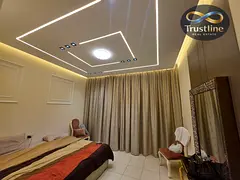 spacious two-bedroom apartment for sale in Ajman One Tower with a beautiful view of the city and the
