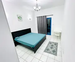 Spacious Couple Room with Balcony for Rent in Al Muraqqabat Deira