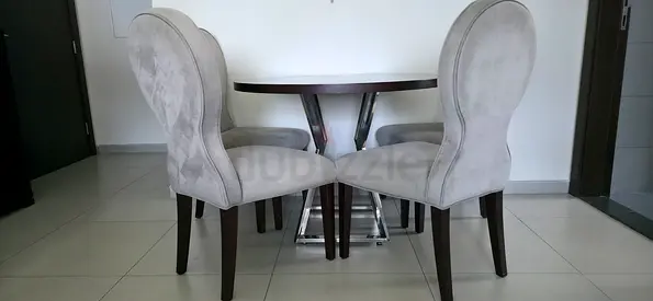 Stylish Round Dining Table with Elegant Chairs