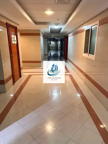 Premium class 1bhk in Fully Family building🏢 Near Sahara center Al nahda Sharjah 1Room with cupboard and close Hall premium kitchen with new woodish cabnots perfect for families