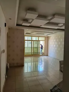 1BR apartment for rent in Al Taawun Sharjah, 2 baths, balcony, central AC, prime location near servi
